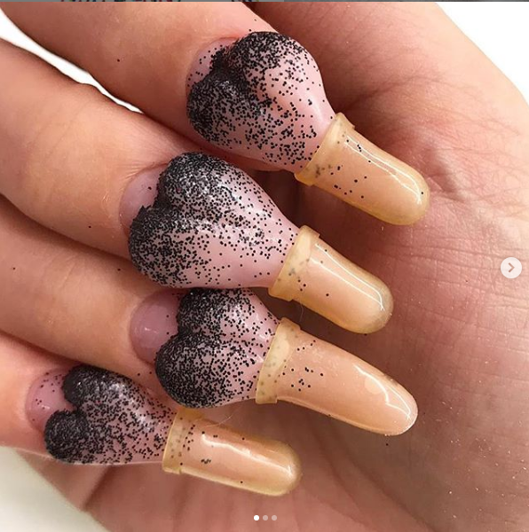 bizarre_nail_art_condon_on_nail_1_